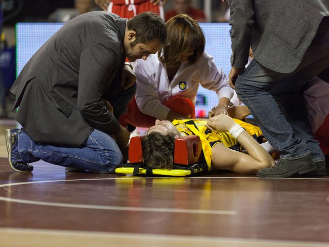 A basketball player from Sutor Montegranaro (IT) is lying on the ground after an injury in the match against Scavolini Pesaro (IT) in Ancona, Italy on April 16th, 2011.